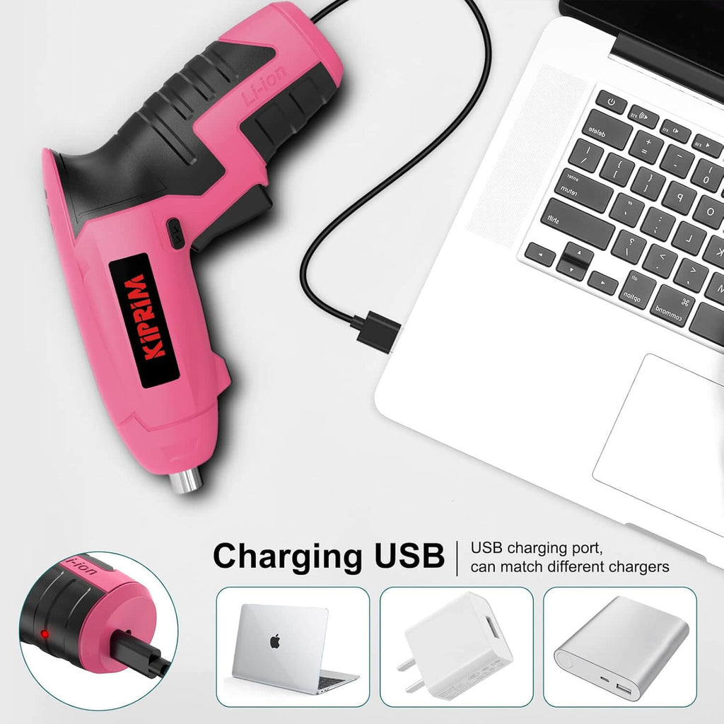 Kiprim ES5 Pink Electric Screwdriver being charged via USB with laptop in background.